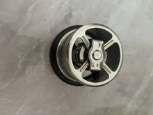 Carica l'immagine nel visualizzatore di Gallery, Automotive thermostat housing with metal insert and black plastic base, side view
