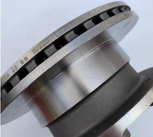 Charger l'image dans la galerie, Rear brake disc rotor close-up showing stamped markings and vent slots on silver face by SUONAMA