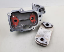 Carregar imagem no visualizador da galeria, Oil filter housing with detached filter head cover, internal red components visible