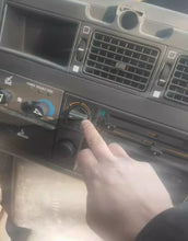 Charger l'image dans la galerie, Heating knob switch on dashboard control panel, hand turning the knob