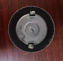Cargar imagen en el visor de la Galería, Fuel tank cap top with black outer ring, circular center, and two mounting tabs