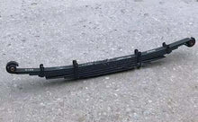 Carregar imagem no visualizador da galeria, Black metal leaf-spring suspension pack for 4x4 with end eye mounts, angled view