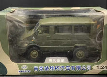 Charger l'image dans la galerie, 1:24 scale green camouflage van model in clear display box, front view
