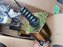Charger l'image dans la galerie, Clutch booster actuator with gold-toned end plate and black rubber boots, side view
