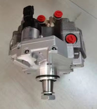 Charger l'image dans la galerie, Fuel injection pump with silver housing, black inlet, and red capped ports