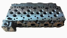 Carica l'immagine nel visualizzatore di Gallery, Cylinder head casting with multiple circular port openings and oil passage channels