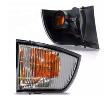 Carica l'immagine nel visualizzatore di Gallery, Front mirror indicator lamp with amber lens and black housing, angled view