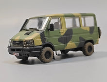 Charger l'image dans la galerie, 1/72 camo off-road SUV model with black grille and rugged tires, side front view