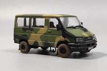 Charger l'image dans la galerie, 1/72 camo off-road SUV model with black front grille and rugged tires, three-quarter view
