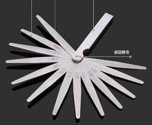 Carica l'immagine nel visualizzatore di Gallery, Valve clearance gauge with fan of metal blades and clearance scale on wheel.