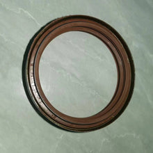 Carregar imagem no visualizador da galeria, Oil seal ring with dark brown outer lip and silver sealing surface