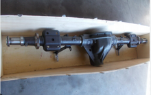 Cargar imagen en el visor de la Galería, Rear axle housing with axle shafts and disc brake backing plate, mounted on stand