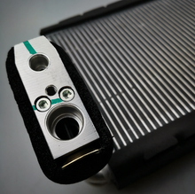 Cargar imagen en el visor de la Galería, Car HVAC evaporator core detail with metal ports and black foam mounting