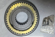 Carica l'immagine nel visualizzatore di Gallery, Transmission synchronizer gear assembly with yellow teeth and central splined hub, with bolts