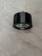 Carregar imagem no visualizador da galeria, Black cylindrical belt tensioner pulley with central bolt, top view