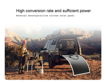 تحميل الصورة في عارض المعرض، Portable flexible solar panel with metal grommets charging a vehicle outdoors