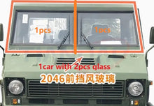 Charger l'image dans la galerie, Front windshield glass panel for 4x4 vehicle, shown installed in front cab.