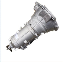 Carica l'immagine nel visualizzatore di Gallery, Automatic transmission assembly with gray metal casing and side mounting bracket