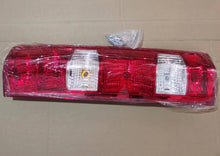 Carica l'immagine nel visualizzatore di Gallery, Red tail lamp with two clear rectangular lenses and amber bulb, wrapped for shipping by SUONAMA