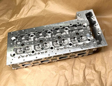 Load image into Gallery viewer, Cylinder head assembly with multiple cylinder bores and bolt holes on silver plate