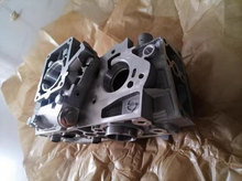 Load image into Gallery viewer, Engine oil pump housing with circular openings and side plate, gray metal by SUONAMA.