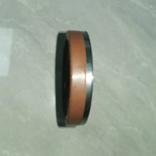 Carregar imagem no visualizador da galeria, Oil seal ring with brown rubber insert and black outer edge, side view