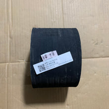 Carica l'immagine nel visualizzatore di Gallery, Short dark rubber truck hose section with paper label and textured surface