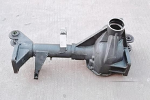 Load image into Gallery viewer, Front drive axle housing with U-joint flange and mounting brackets, metal gray