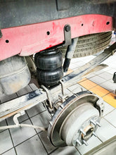 تحميل الصورة في عارض المعرض، Rear air suspension installed under vehicle: air bellows, brackets, and mounting hardware