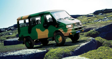 Load image into Gallery viewer, Front bumper plastic sheet installed on a green 4x4 vehicle