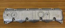 Load image into Gallery viewer, Aluminum valve cover with mounting holes and circular ports, silver-gray.