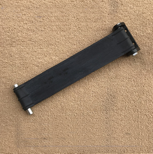 Cargar imagen en el visor de la Galería, Black door stopper assembly with ribbed bar, metal posts, and side bracket