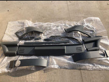 Carica l'immagine nel visualizzatore di Gallery, Front bumper shield components: dark plastic center panel and side guards with mounting holes