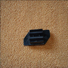 Carica l'immagine nel visualizzatore di Gallery, Black W-shaped button retainer with rectangular grooves, side view