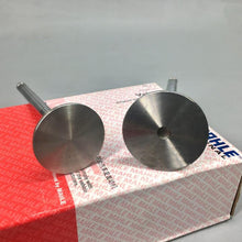 Charger l'image dans la galerie, Intake and exhaust valve heads close-up on red engine parts box, steel finish.