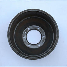 Załaduj obraz do przeglądarki galerii, Brake drum with dark outer surface and circular mounting flange with bolt holes
