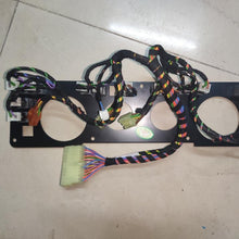 Carica l'immagine nel visualizzatore di Gallery, Black dashboard instrument panel with wiring harness and multi-color connectors, circular openings
