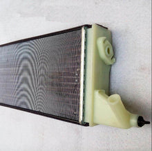 Charger l'image dans la galerie, Warm air radiator housing with mesh heat core, vented grille, and mounting tabs