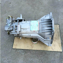 Charger l'image dans la galerie, Silver metal transmission gearbox case with attached gear assembly and mounting holes