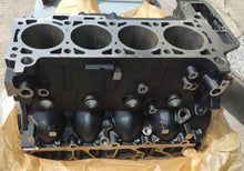 Carregar imagem no visualizador da galeria, Engine cylinder block showing four cylinder bores and row of mounting holes