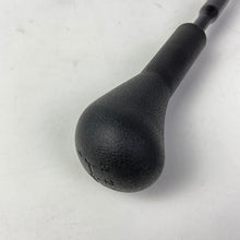 Charger l'image dans la galerie, Gear lever sleeve assembly: dark textured rubber knob with rounded end, close-up view.