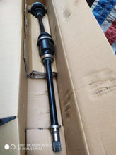 Charger l'image dans la galerie, Front drive shaft with two black rubber boots and long metal axle, near end
