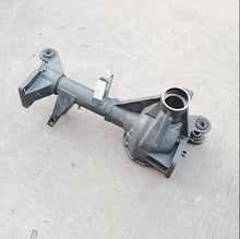 Carica l'immagine nel visualizzatore di Gallery, Front drive axle housing with side brackets and round bearing mount, metal gray