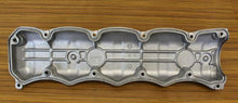 Charger l'image dans la galerie, Aluminum valve cover underside with gasket channels and bolt holes, silver-gray.