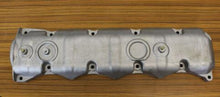 Charger l'image dans la galerie, Aluminum valve cover with mounting holes and circular ports, silver-gray.