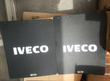 تحميل الصورة في عارض المعرض، Two black mud flap panels with white IVECO logo and mounting tabs