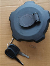 Charger l'image dans la galerie, Fuel tank cap with dark blue plastic cover, keys, and attached chain
