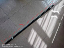 Cargar imagen en el visor de la Galería, Torsion bar laid on floor with measurement lines; long blue steel rod.