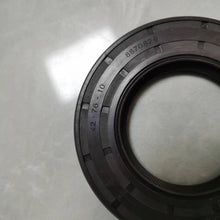 Carica l'immagine nel visualizzatore di Gallery, Close-up rubber shaft oil seal with stamped part number and circular sealing lip