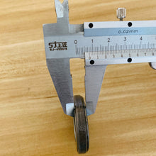 Charger l'image dans la galerie, Steering bearing close-up with metal outer ring, measured by calipers